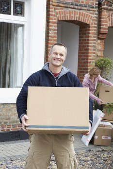 Professional movers handling flat removals in Wimbledon near apartment buildings
