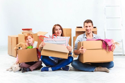 Professional movers handling boxes for a Wimbledon relocation