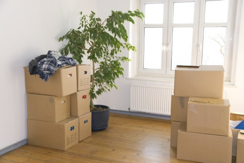 Movers transporting furniture carefully during a scheduled relocation