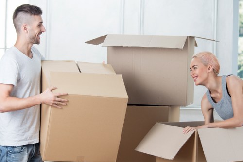 Removal team packing and protecting household furniture