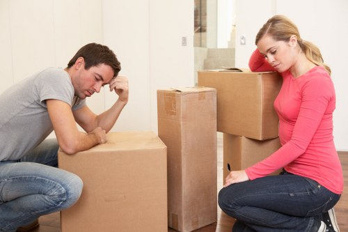 Workers following safe procedures during a house move