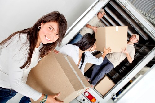 Local movers handling a flat relocation in Wimbledon with stairs and access planning