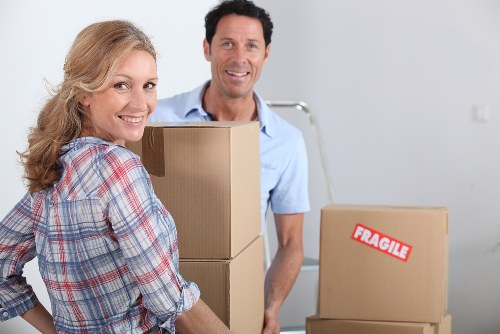Local movers in Wimbledon transporting furniture safely through a residential street