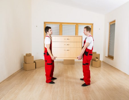 Professional movers handling furniture during same day removals in Wimbledon