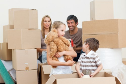 Careful loading of boxes and household items during a Wimbledon flat move